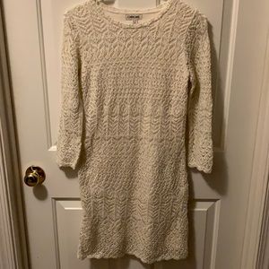 Shimmering holiday dress cream lined expect in arms unlined.